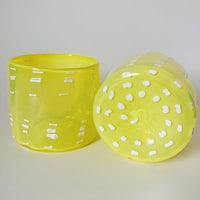 two yellow vases with white dots on them